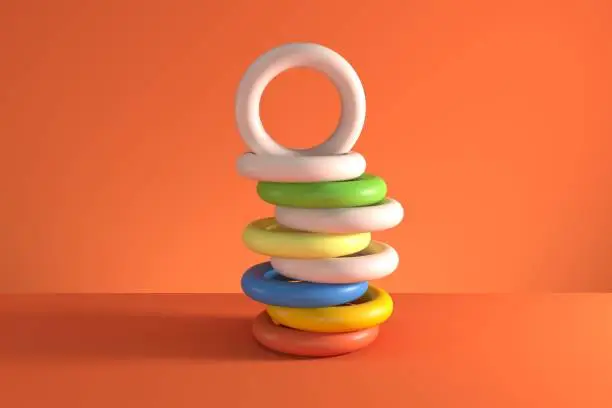 Photo of Pile of random shifted colorful tori (torus shape) isolated on orange background. Minimal concept idea. 3D Render.