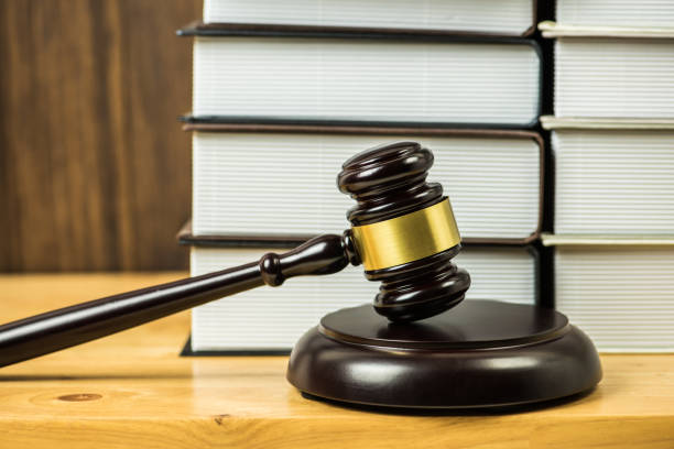 istock Close-Up Of Gavel And Books On Table 1147725678