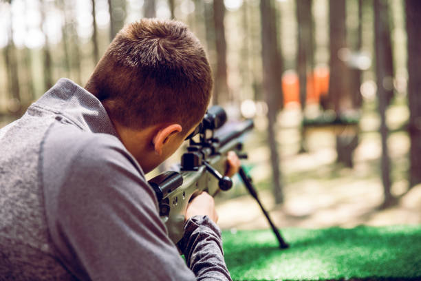 istock Teenager Learning How to Use a Rifle 1147727643