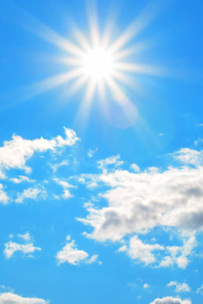 istock Sun with beautiful beams in the blue sky with some clouds 1147731166