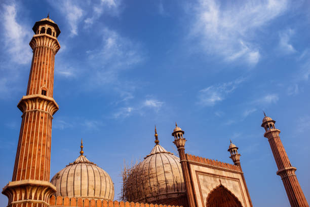 istock Main mosque in the city under construction. The main dome under construction. pillars, domes, speakers, gates with beautiful, serene, cloudy, morning sky int the background. 1147735829