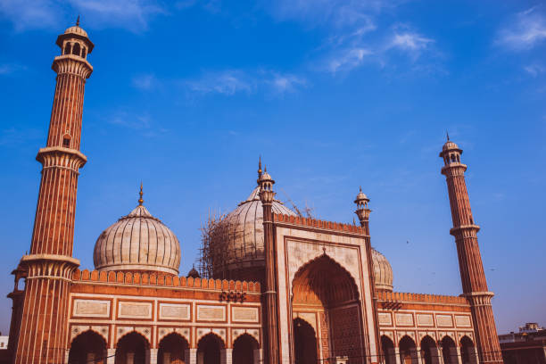 istock Main mosque in the city under construction. The main dome under construction. pillars, domes, speakers, gates with beautiful, serene, cloudy, morning sky int the background. 1147735889