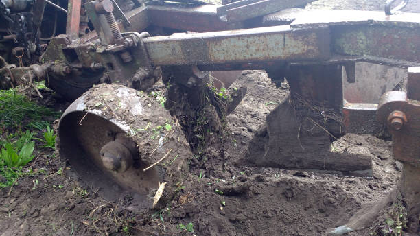 istock Agriculture. The tractor plows the land. Rustic, modern. 1147735996