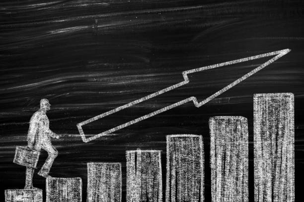 istock Businessman walking up on bar graph 1147737010