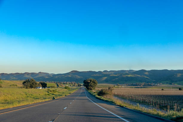 traveling at scenic highway no 1 near Santa Maria in late afternoon sun traveling at highway no 1 near Santa Maria in late afternoon sun santa maria california photos stock pictures, royalty-free photos & images