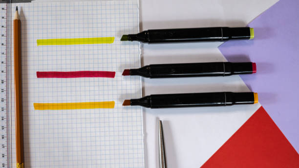 istock Open Colored Felt Tip Pens lie on the open notebook. Stationery for schoolchild or student 1147739914