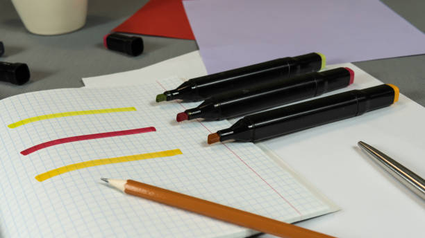 istock Open Colored Felt Tip Pens lie on the open notebook. Stationery for schoolchild or student 1147739922
