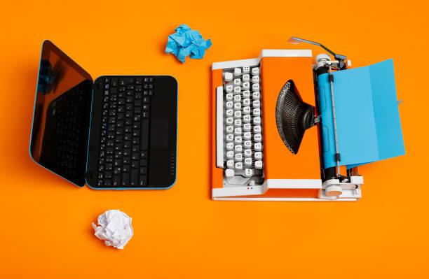 istock Digital and analog – Laptop and 70s Typewriter 1147739949
