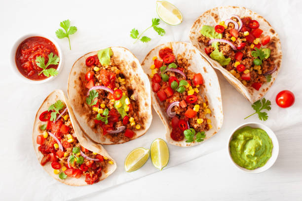 istock mexican beef and pork tacos with salsa, guacamole and vegetables 1147741004