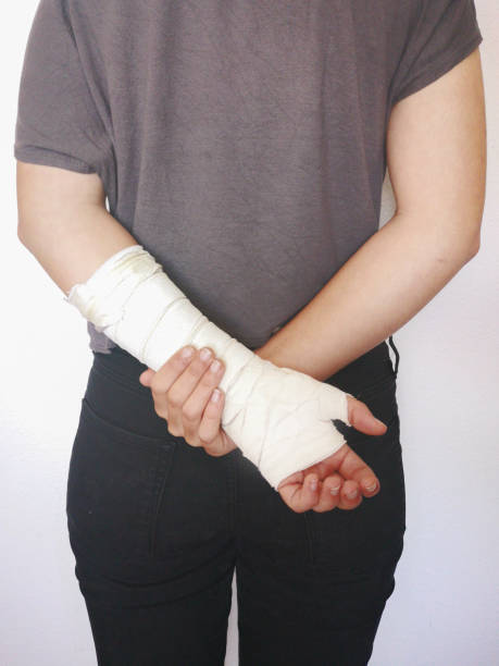 istock girl with bandaged arm 1147741138