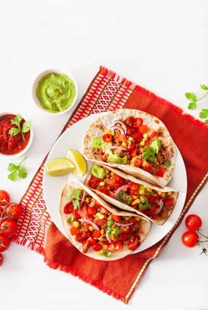 istock mexican beef and pork tacos with salsa, guacamole and vegetables 1147741211