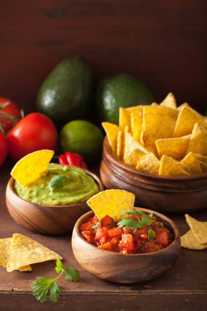 istock mexican nachos tortilla chips with guacamole and salsa dip 1147742622
