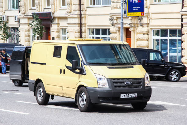 Ford Transit Moscow, Russia - June 2, 2013: Armored encashment truck Ford Transit in the city street. ford crossing stock pictures, royalty-free photos & images