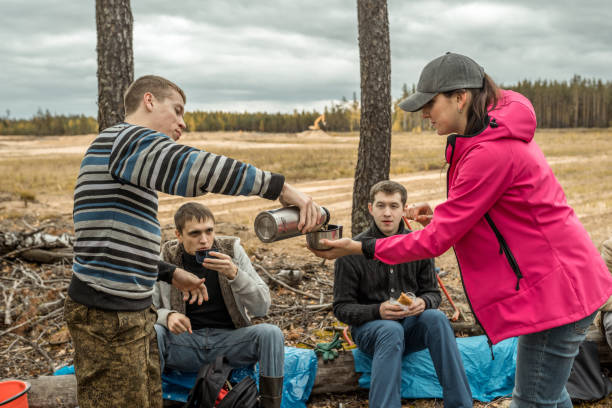 istock Group Of Hikers Rests, Drinks And Have Snack 1147748993