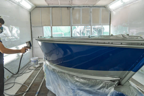 istock spray gun with paint for painting a boat 1147764269