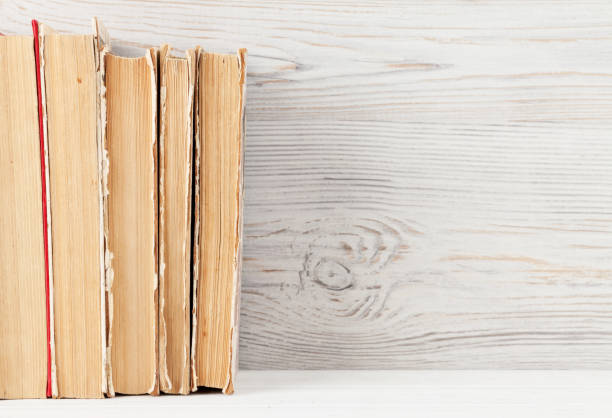 istock Home office workplace with stack of old books 1147766713