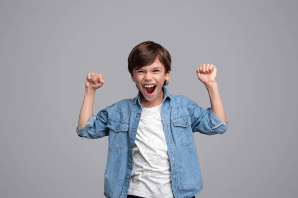 istock Stylish boy celebrating victory 1147768086