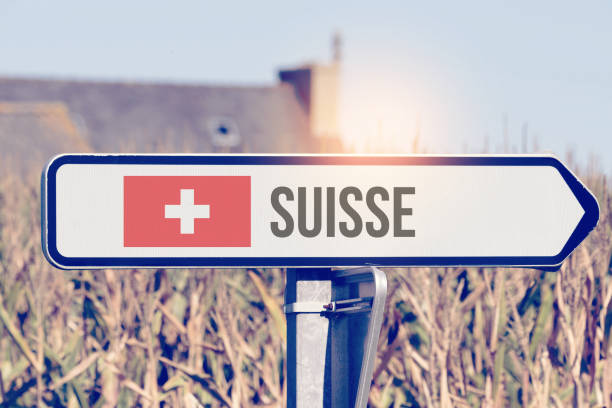 A sign points to the direction of Switzerland