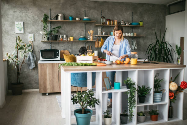 istock Pregnant woman making juice 1147774511