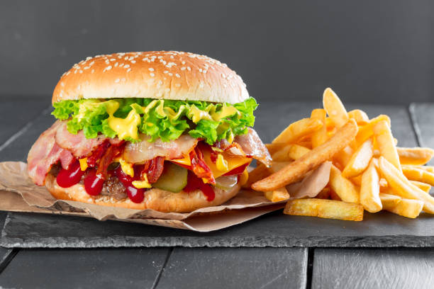 istock Hamburger with fries on a slate plate 1147777193