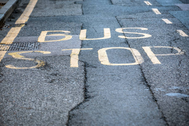 istock Word Bus Stop written on asphalt 1147778314