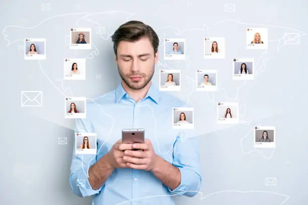 Photo of Close up portrait serious successful guy manager bristle looking his telephone typing sms through 5g internet different ladies pictures illustration microblogging isolated grey background