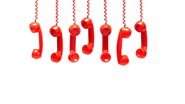 istock Various views of old red telephone receivers isolated on white background with texting space 1147786527
