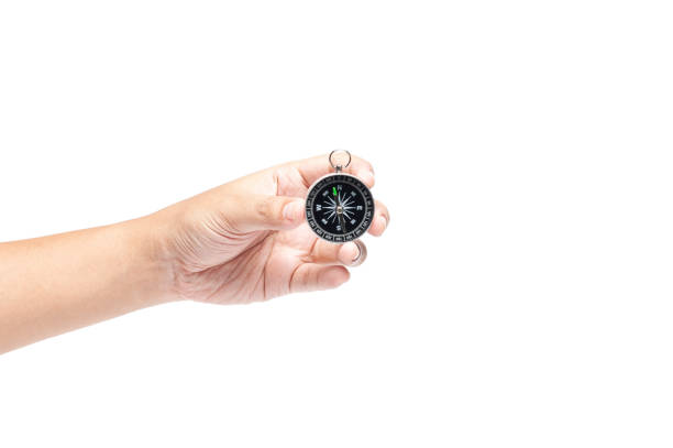 istock Hand holding compass isolated on white background, travelling or business direction concept with texting space. searching direction with compass. 1147786947