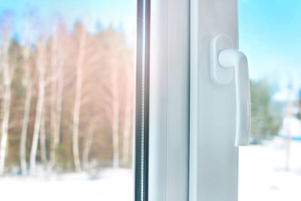 istock Home comfort. Plastic window with handle. Cold winter weather outside the window. 1147788664