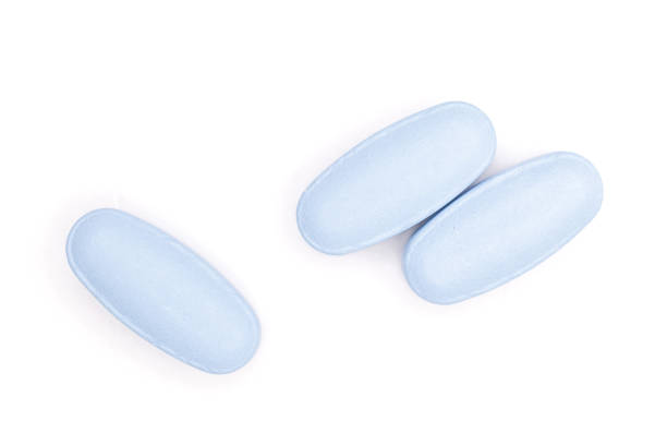 istock Blue medical pills isolated on white 1147788784