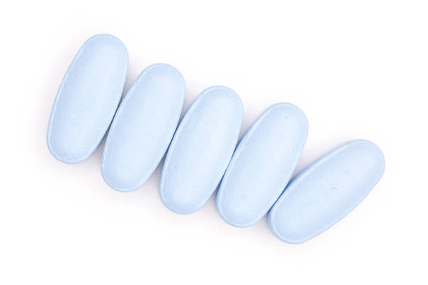 istock Blue medical pills isolated on white 1147788806