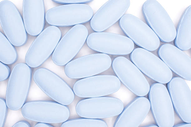 istock Blue medical pills isolated on white 1147788852