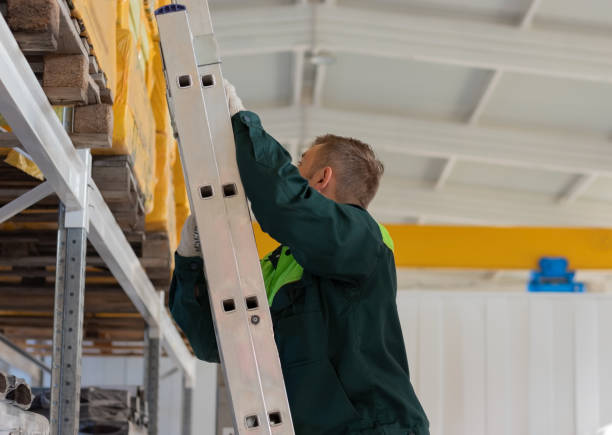 istock Worker performs work on the placement of products in the warehouse. 1147789144