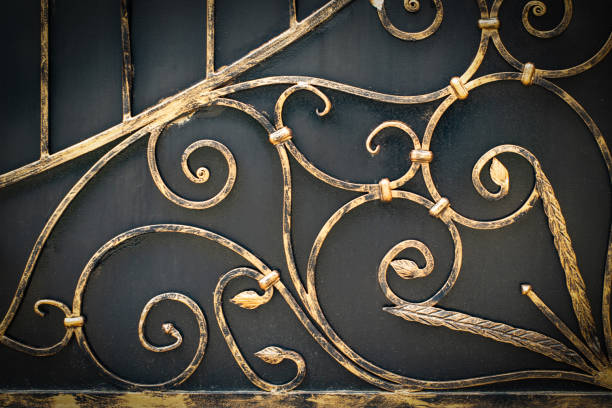 istock Wrought-iron gates, ornamental forging, forged elements close-up. 1147790095