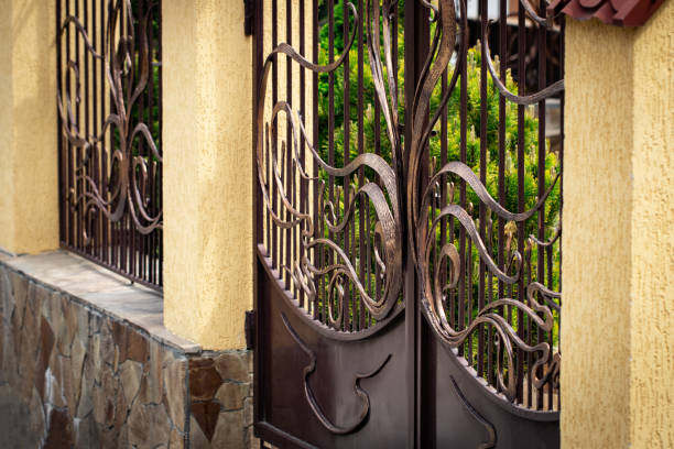 istock Wrought-iron gates, ornamental forging, forged elements close-up. 1147790117