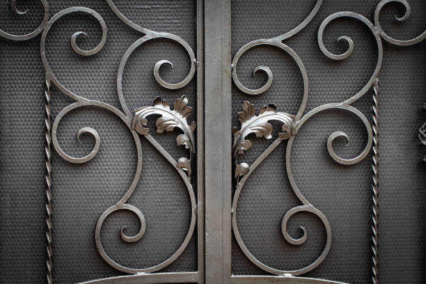 istock Wrought-iron gates, ornamental forging, forged elements close-up. 1147790139