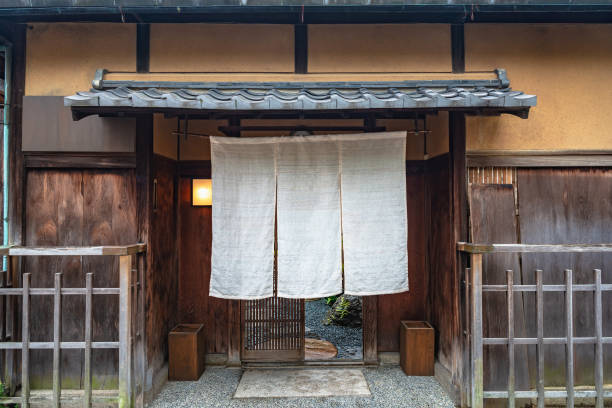 Japanese fabric curtain Traditional Japanese fabric curtain in Kyoto, Japan eaves stock pictures, royalty-free photos & images