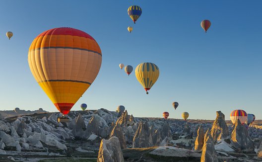 Flying hot air balloons in early morning in Cappadocia