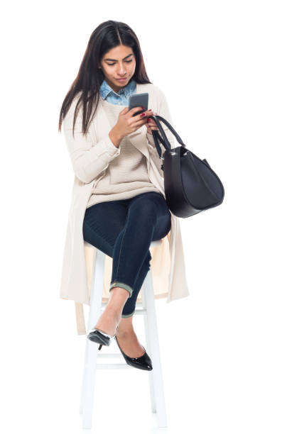 istock Attractive young latino female is sitting 1147794345