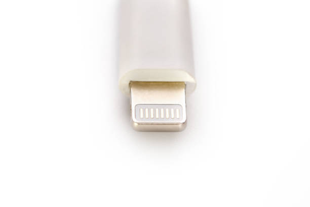 istock Connector lightning on a white background. This is a proprietary connector used to connect mobile devices to well-known host computers 1147795812