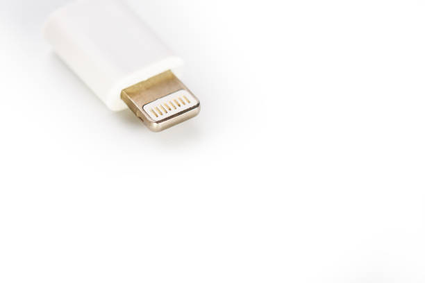 istock Connector lightning on a white background. This is a proprietary connector used to connect mobile devices to well-known host computers 1147795879