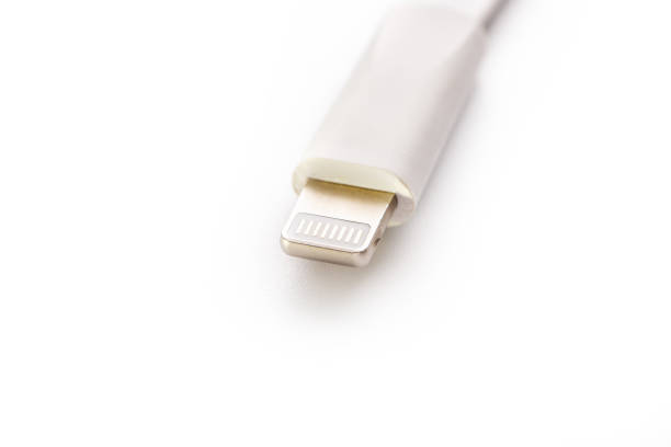 istock Connector lightning on a white background. This is a proprietary connector used to connect mobile devices to well-known host computers 1147795891