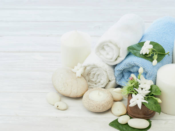 istock Spa concept with jasmine flowers on a white wooden background 1147796610