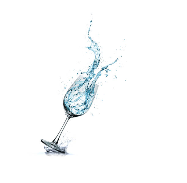 istock water splash in glass isolated. 1147797559