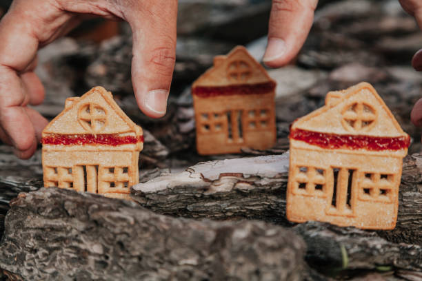 istock Biscuitshaped cookie stands on bark of  tree 1147801344