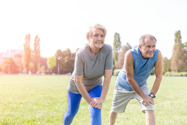istock Determined senior couple exercising together in park 1147805050