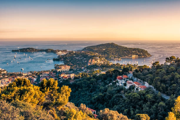 Sunset on the French Riviera French Riviera coastline in Saint-Jean-Cap-Ferrat french riviera stock pictures, royalty-free photos & images