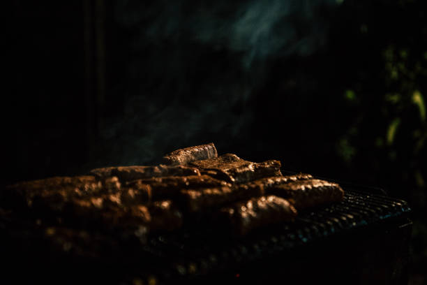 Closeup of barbeque with meat at night