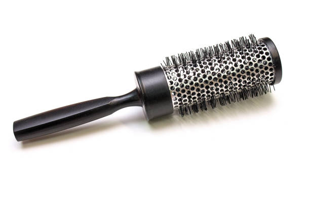 Massage round hairbrush isolated on white background