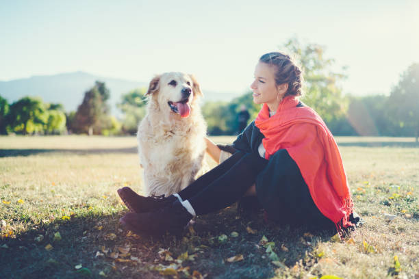 istock Girl with dog among nature 1147808513